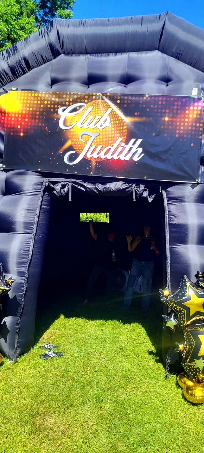 Club Judith inflatable nightclub entrance with disco ball signage
