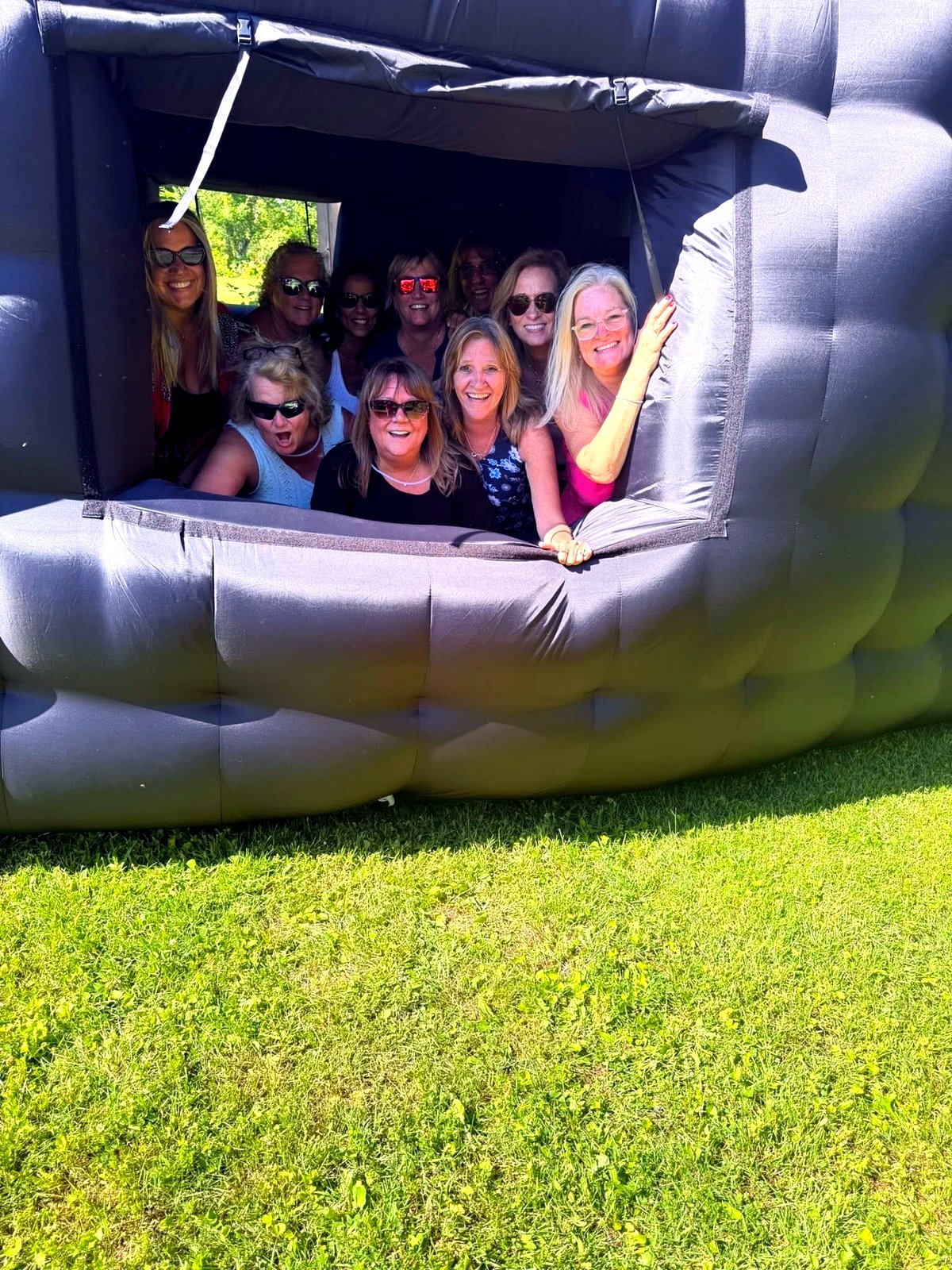 Group of guests smiling inside the inflatable nightclub